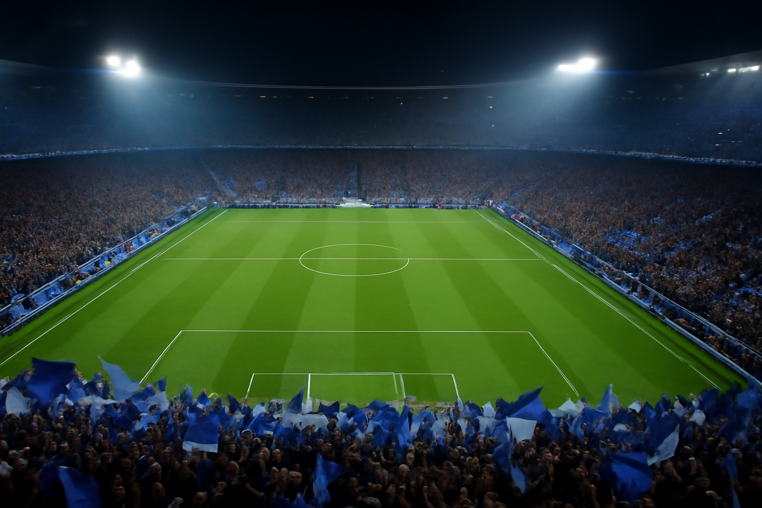 Stadion sepak bola malam hari pada matchday Liga Champions dengan tribun penonton penuh
